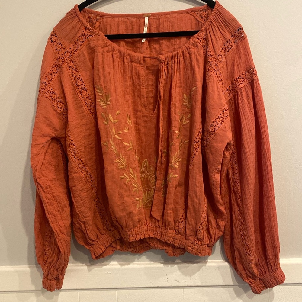 Free People Top , size medium embroidered print on front, draw string neckline